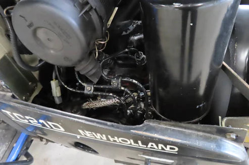 Tracteur compact New Holland TC 21 D – 4x4 – Transmission hydrostatique